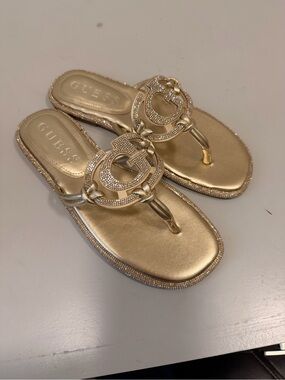 GUESS Gold Metallic Logo Thong Sandals with Crystal Accents